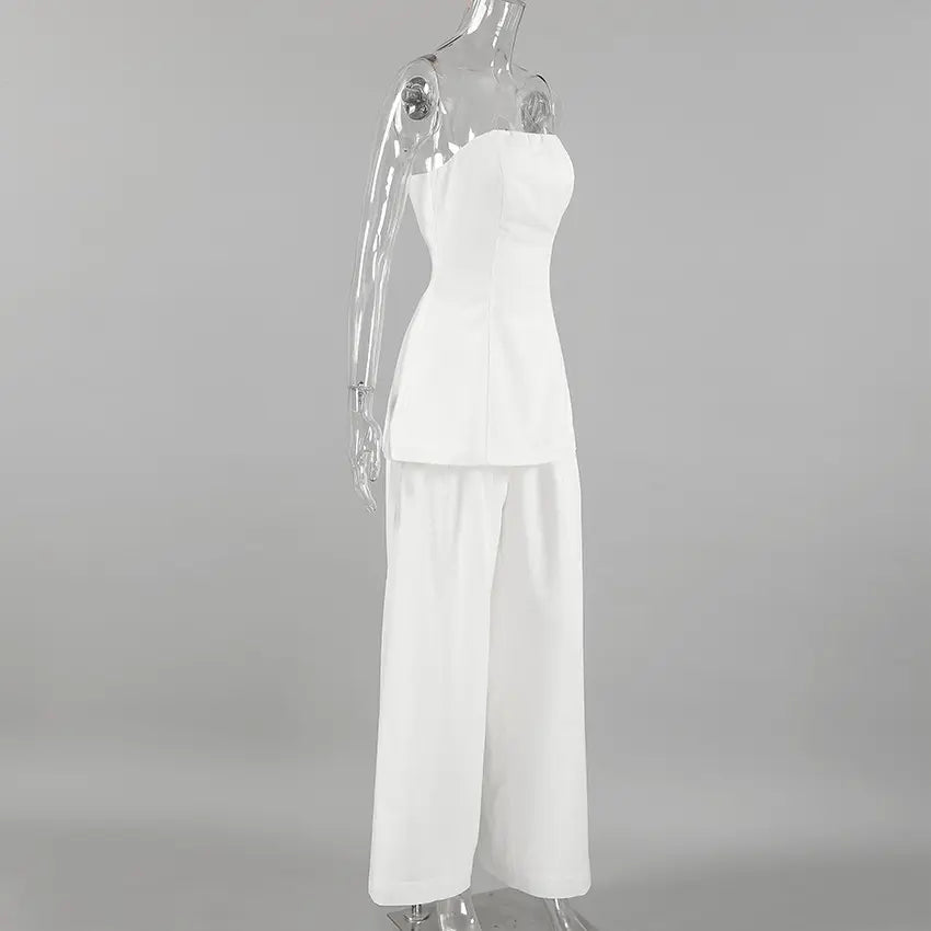 Side view of the Zyra linen set featuring an ivory strapless bandeau top and flowing wide-leg pants displayed on a mannequin.