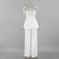 Back view of an elegant off-white linen two-piece set featuring a strapless bandeau top and high-waisted wide-leg trousers, showcasing fluid drape and premium fabric texture.