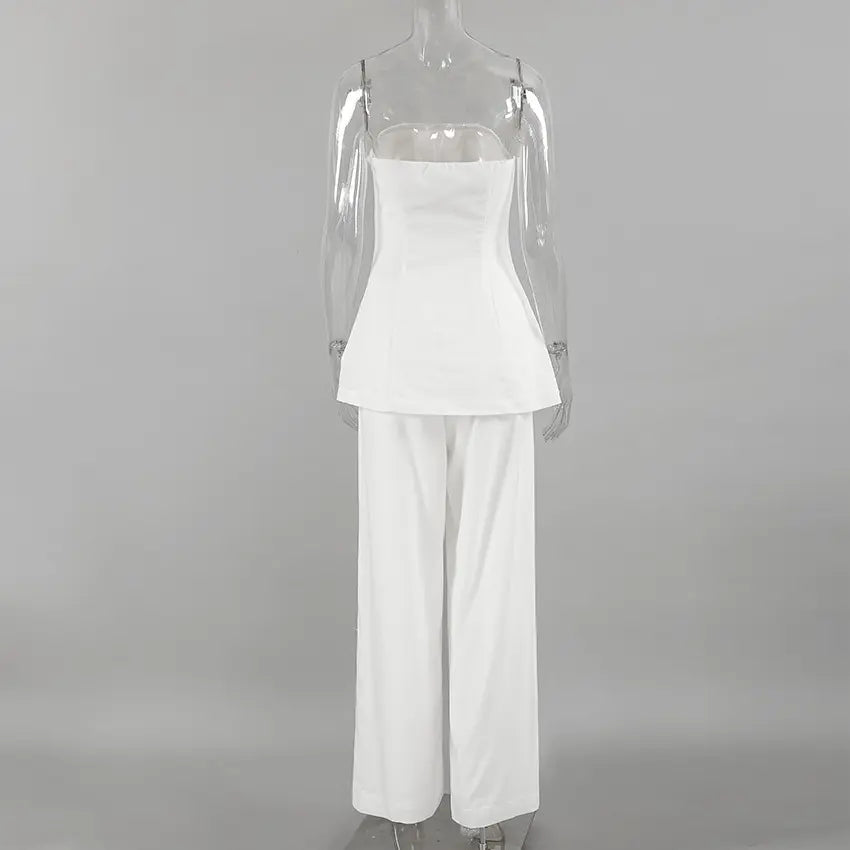Back view of an elegant off-white linen two-piece set featuring a strapless bandeau top and high-waisted wide-leg trousers, showcasing fluid drape and premium fabric texture.