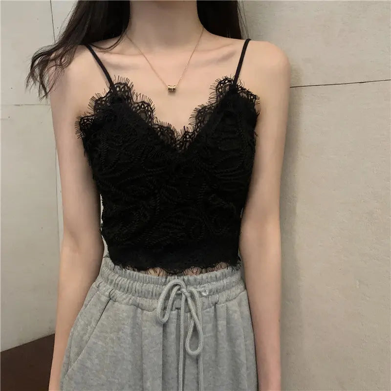 Model wearing Zyrin black floral lace cropped camisole with a romantic V-neck and delicate eyelash trim, featuring slim spaghetti straps.